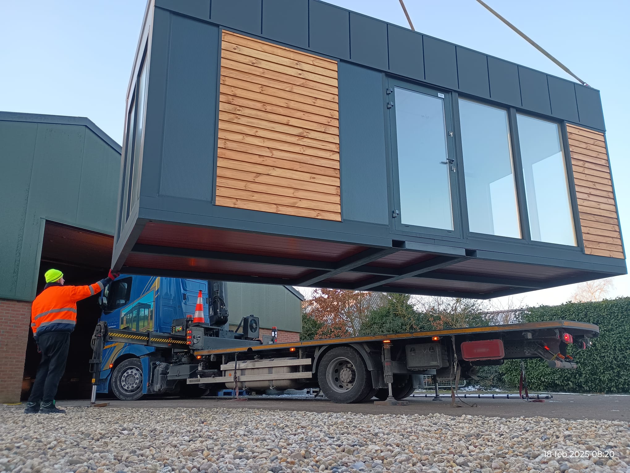 Container being unloaded with crane